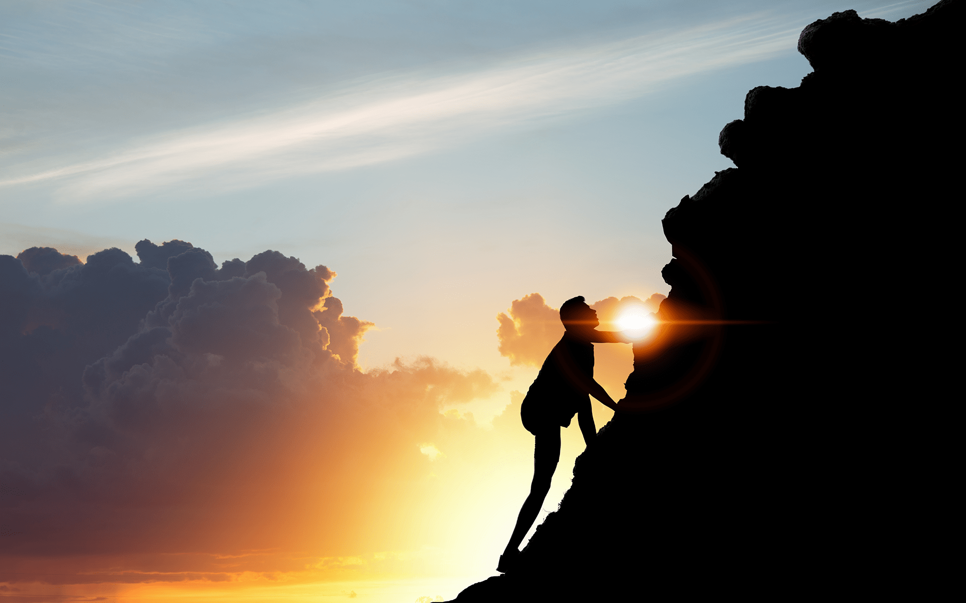 man climbing mountain